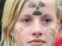 girl with crosses on fac