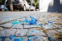 Remains of the paint bombs used to vandalise the façade of the apartment building on Franz-Klühs-Straße in Berlin Kreuzberg, Germany. 