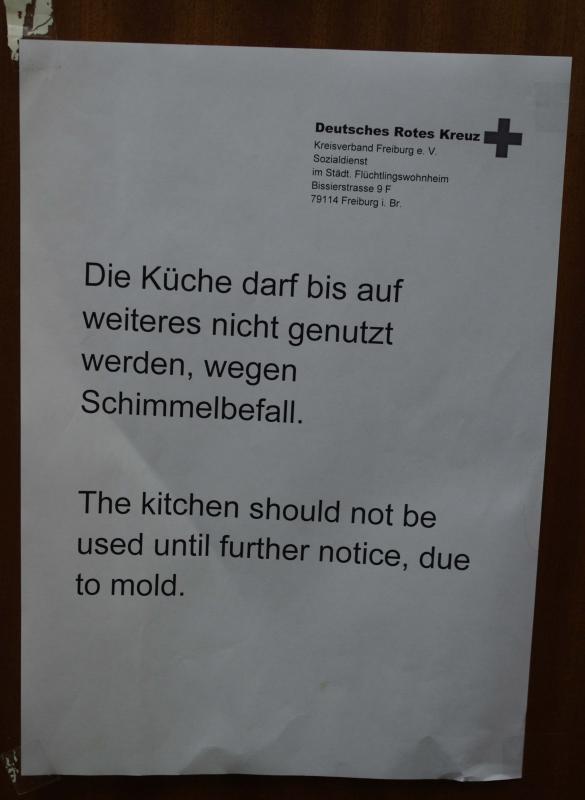 Warning sign on one kitchen door, been hanging for months